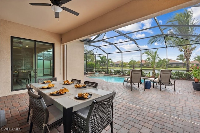 view of patio / terrace featuring a lanai and ceiling fan