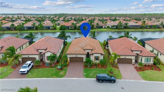 drone / aerial view with a water view