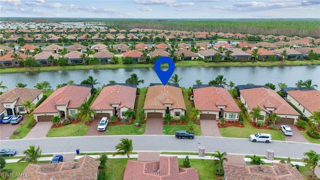 birds eye view of property featuring a water view