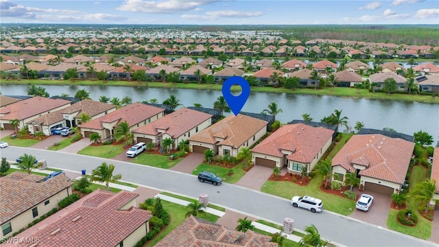 bird's eye view with a water view