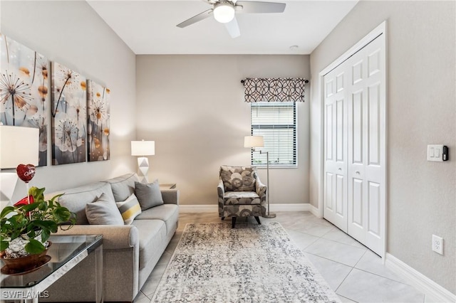 living room with ceiling fan and light tile patterned flooring