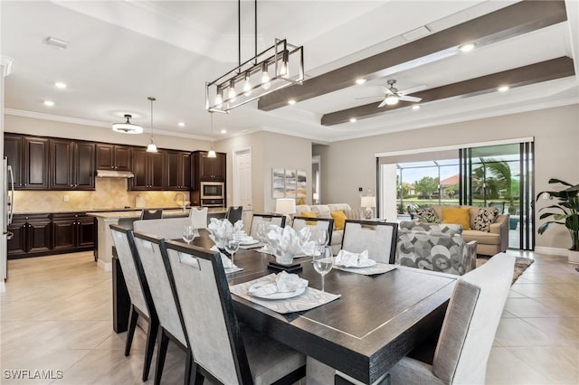 dining room with ceiling fan, light tile patterned flooring, and crown molding