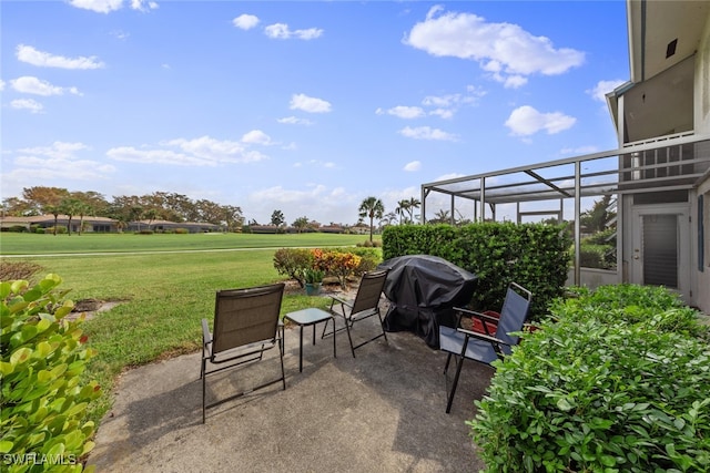 view of patio / terrace featuring grilling area and glass enclosure