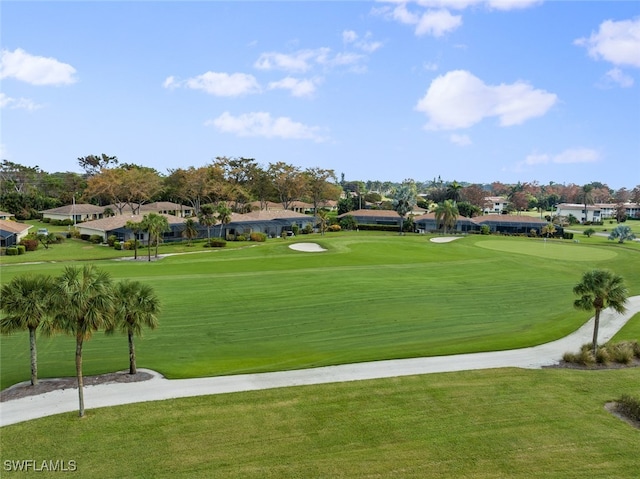 view of property's community featuring a yard