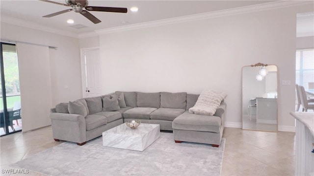 3195 Pacific Dr, Naples, FL 34119 - living area with a wealth of natural light, light tile patterned floors, a ceiling fan, and ornamental molding