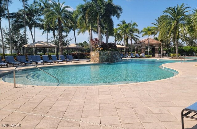 3195 Pacific Dr, Naples, FL 34119 - community pool with a gazebo and a patio area