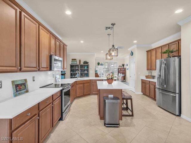 kitchen featuring visible vents, ornamental molding, a kitchen breakfast bar, stainless steel appliances, and light countertops