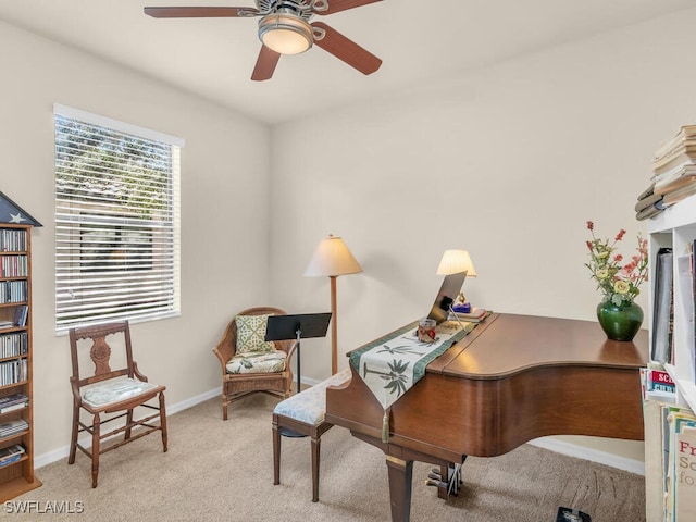 office space with carpet, ceiling fan, and baseboards