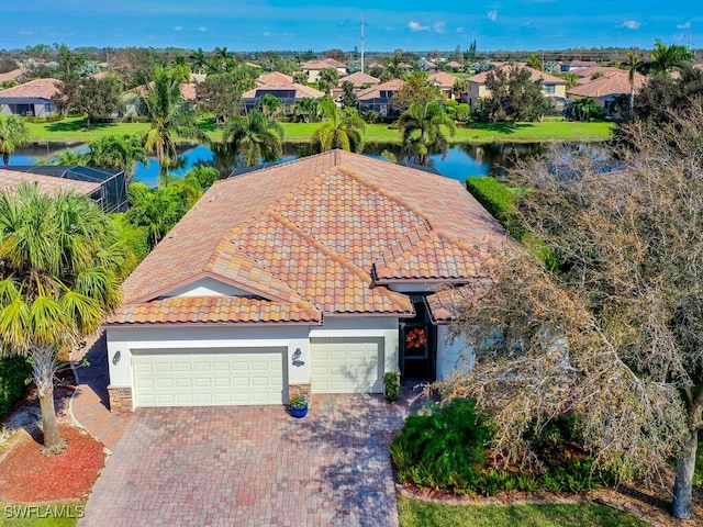 bird's eye view featuring a residential view and a water view