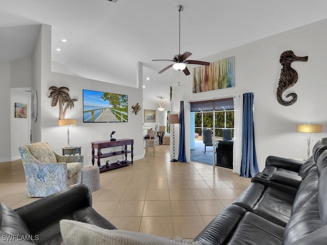 living room featuring high vaulted ceiling, ceiling fan, and light tile patterned flooring