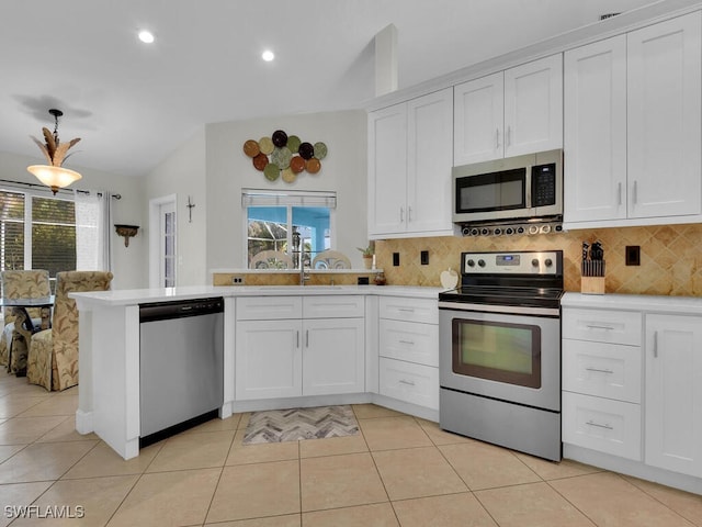 kitchen featuring a wealth of natural light, white cabinets, sink, and stainless steel appliances