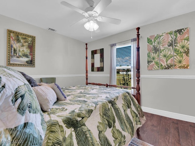 bedroom with hardwood / wood-style flooring and ceiling fan