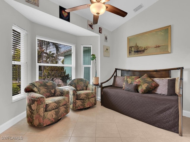 bedroom with light tile patterned flooring, ceiling fan, multiple windows, and vaulted ceiling