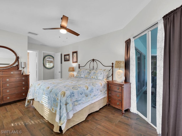 bedroom with ceiling fan, dark hardwood / wood-style floors, and access to exterior