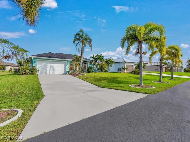 single story home with a garage and a front lawn