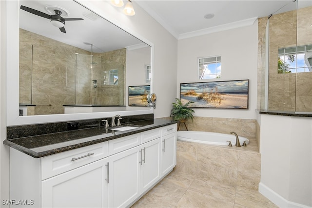 bathroom with vanity, crown molding, shower with separate bathtub, and a healthy amount of sunlight