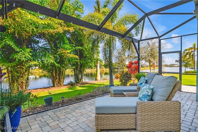 view of patio featuring a water view, a lanai, and an outdoor hangout area