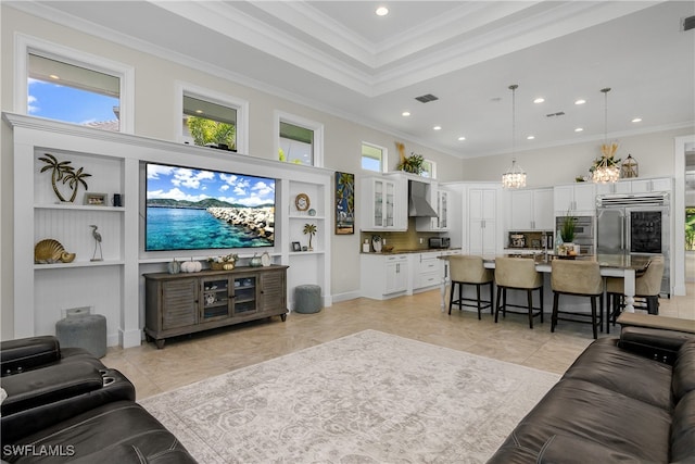 living room with a towering ceiling, ornamental molding, and a wealth of natural light