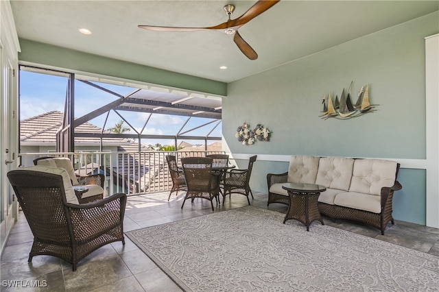 view of patio / terrace featuring a lanai, outdoor lounge area, and ceiling fan