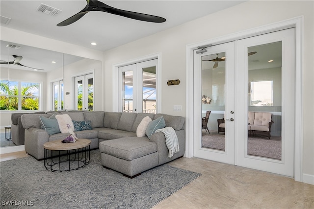 living room with french doors and ceiling fan