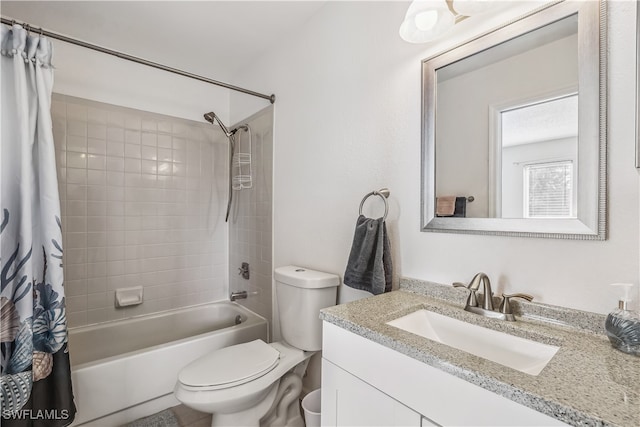 full bathroom featuring vanity, toilet, and shower / tub combo