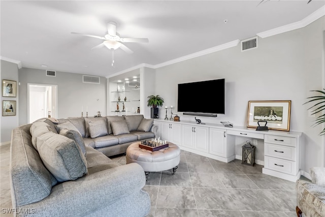 living room featuring ceiling fan, crown molding, and built in desk