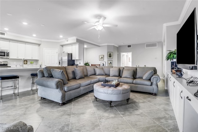 living room featuring crown molding and ceiling fan