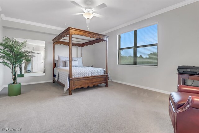 bedroom featuring ceiling fan, crown molding, and carpet flooring