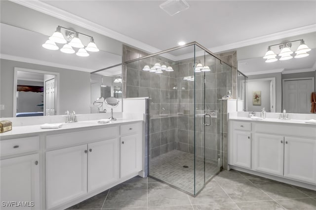 bathroom with walk in shower, vanity, ornamental molding, and tile patterned floors