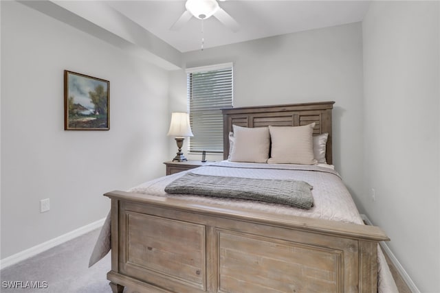 bedroom featuring light carpet and ceiling fan