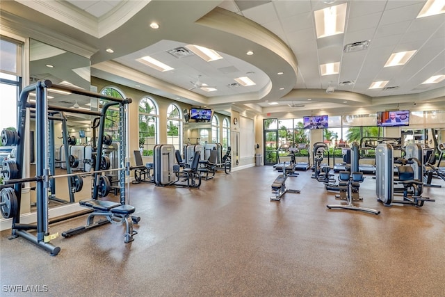 workout area with a drop ceiling and crown molding