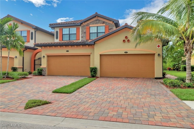 mediterranean / spanish-style home featuring a garage