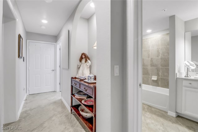 hallway featuring light tile patterned flooring