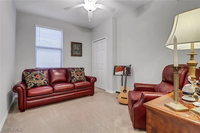 living room with light carpet and ceiling fan