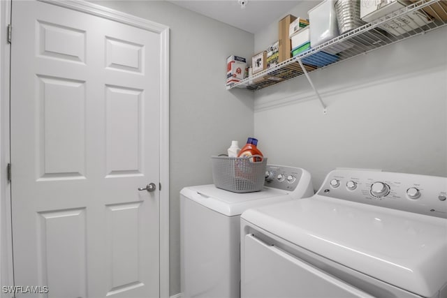 laundry room featuring separate washer and dryer