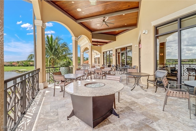 view of patio featuring ceiling fan