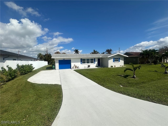 ranch-style house featuring a front yard and a garage