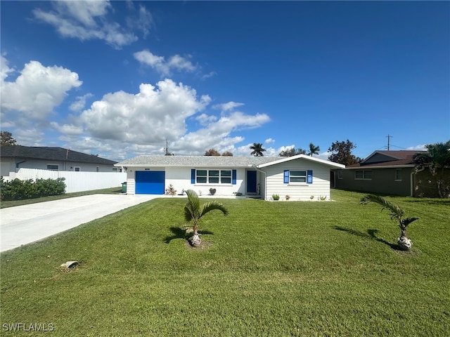 ranch-style house featuring a front yard and a garage