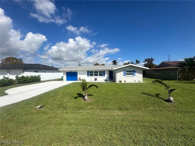 ranch-style house featuring a front yard and a garage