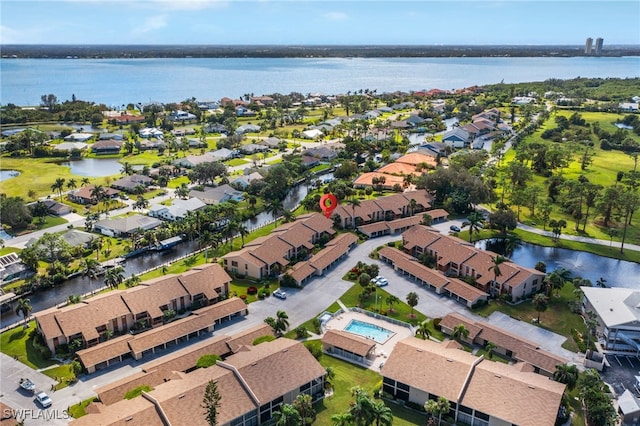 birds eye view of property featuring a water view