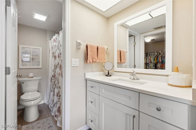 bathroom featuring toilet, vanity, and wood-type flooring