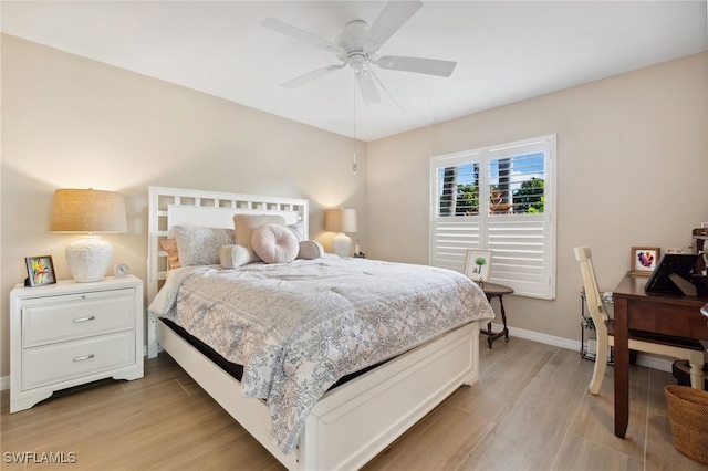 bedroom featuring light hardwood / wood-style flooring and ceiling fan