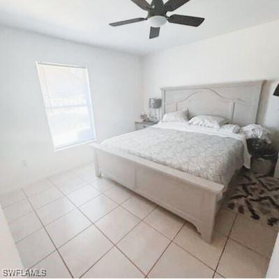 bedroom with light tile patterned floors and ceiling fan