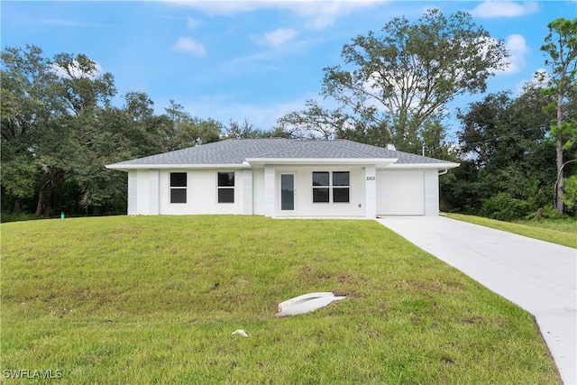 single story home featuring a front yard and a garage