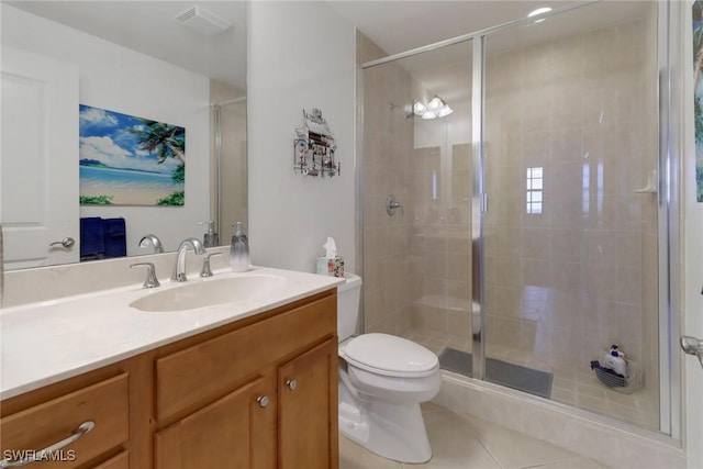 bathroom featuring vanity, toilet, an enclosed shower, and tile patterned flooring