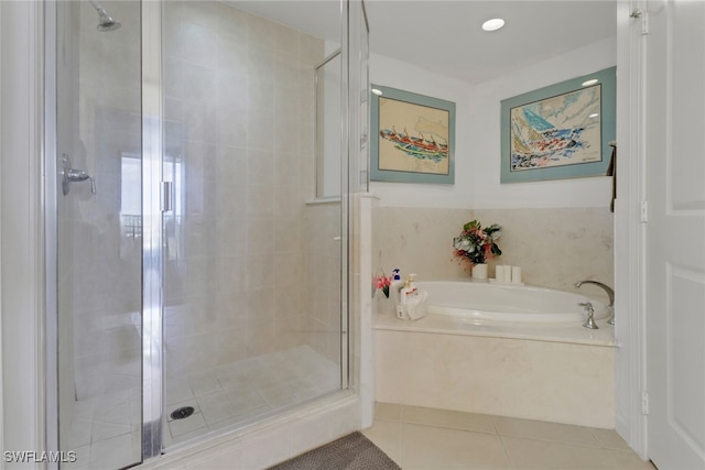 bathroom featuring plus walk in shower and tile patterned flooring