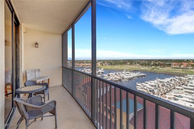 balcony featuring a water view