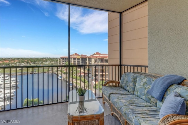 balcony featuring a water view and an outdoor hangout area