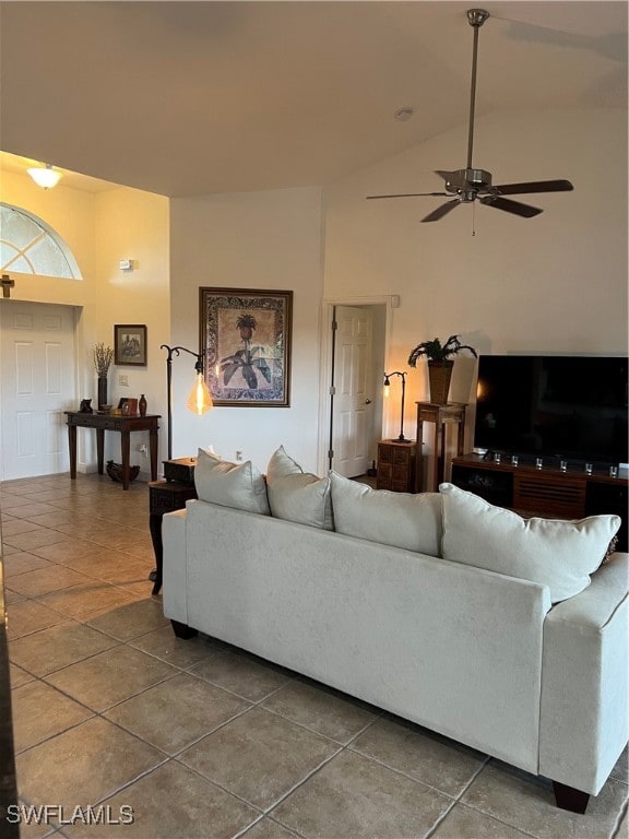 living room featuring ceiling fan, high vaulted ceiling, and tile patterned floors