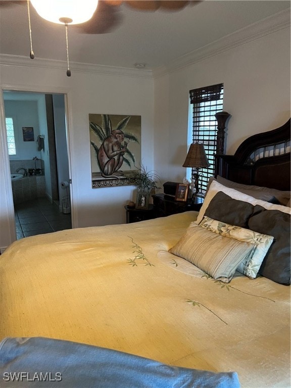 bedroom featuring ornamental molding, ceiling fan, ensuite bath, and tile patterned flooring